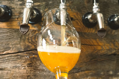 Close-up of beer glass on table