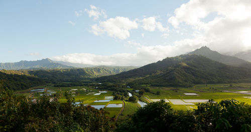 Scenic view of landscape and mountains against sky