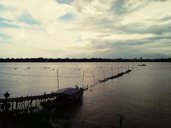 Scenic view of sea against cloudy sky