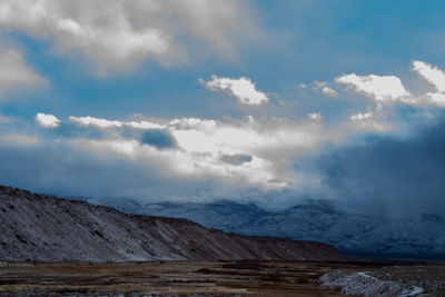 Scenic view of snowcapped mountains against sky