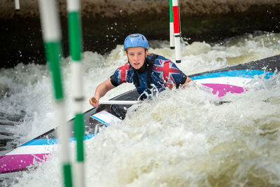 Woman kayaking at river