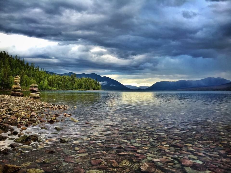 VIEW OF LAKE AGAINST CLOUDY SKY