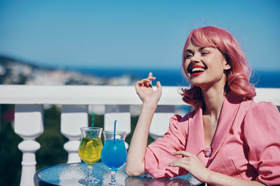 Young woman drinking glass