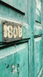 Close-up of text on old door