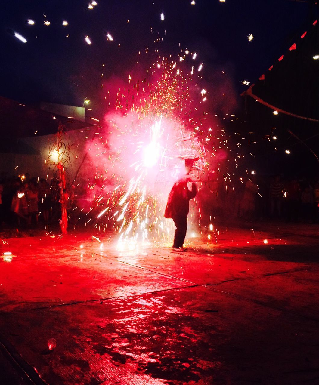 ILLUMINATED FIREWORK DISPLAY AT NIGHT