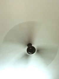 Low angle view of electric lamp on ceiling at home