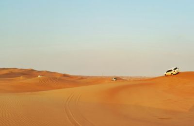 Scenic view of desert against clear sky