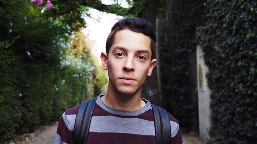 Portrait of young man standing outdoors