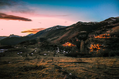 Scenic view of mountains against sky during sunset