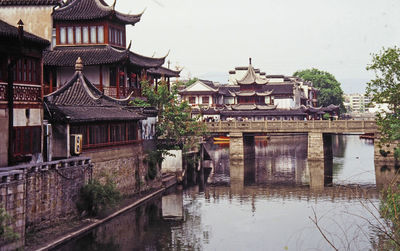 View of castle against built structures