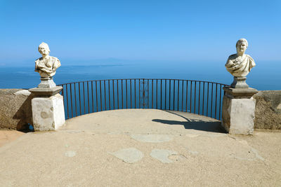 Statue against blue sky