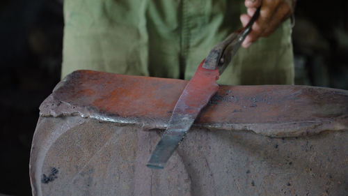 Hot metal is processed on the anvil in the forge. anvil in the forge