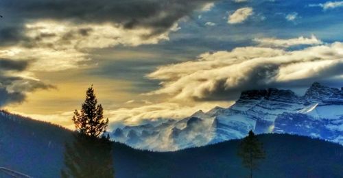 Panoramic view of mountains against cloudy sky