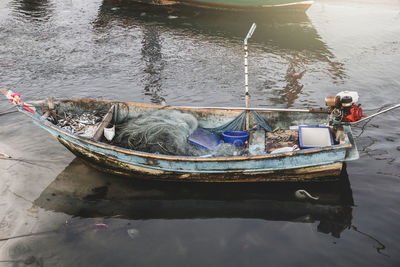 High angle view of fishing boat moored in lake