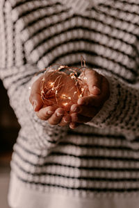 Close-up of hand holding shell