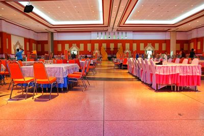 Empty chairs and tables in restaurant