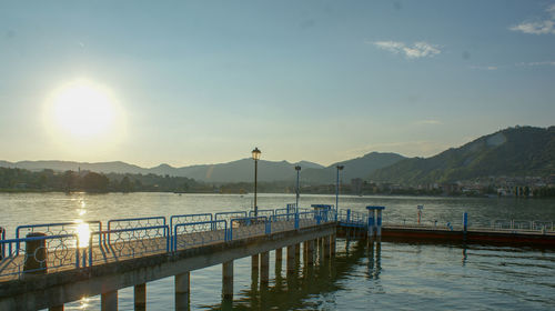 Pier over lake against sky