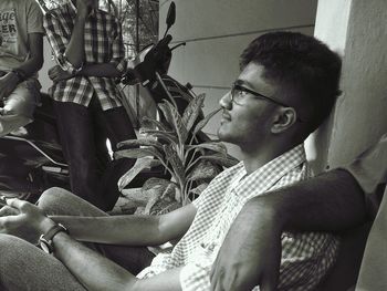 Young man sitting in eyeglasses