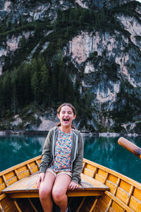Portrait of woman sitting in boat in lake