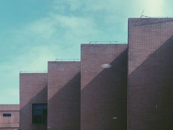 Low angle view of modern building against sky