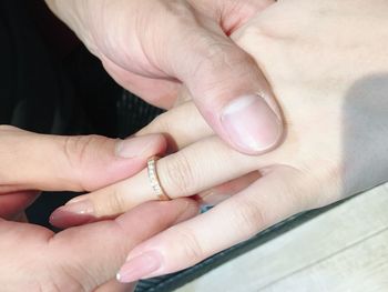 Close-up of couple holding hands