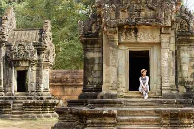 Woman in front of building