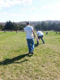 Full length of man standing on grassy field