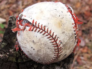 Close-up of old ball on field