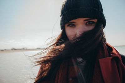 Portrait of beautiful woman against sky