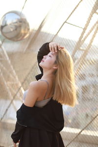Portrait of young woman sitting on floor
