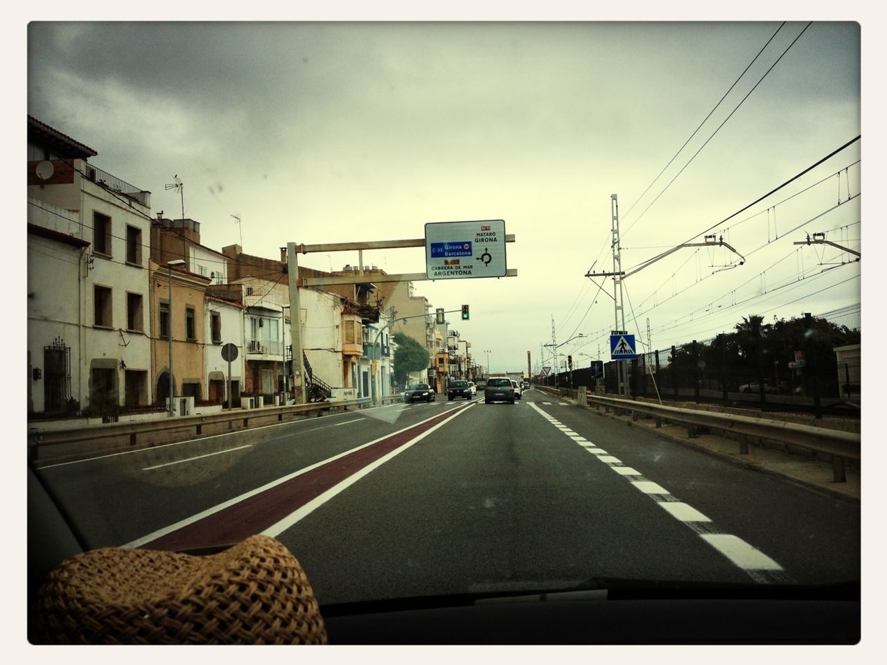 transportation, transfer print, road, car, sky, road marking, the way forward, land vehicle, mode of transport, building exterior, diminishing perspective, street, architecture, auto post production filter, city, built structure, vanishing point, cloud - sky, cloud, travel