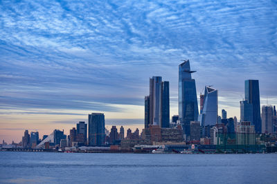 Sea and buildings in city at waterfront