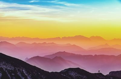 Scenic view of mountains against sky during sunset