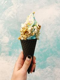 Close-up of hand holding ice cream