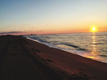 Scenic view of calm sea at sunset