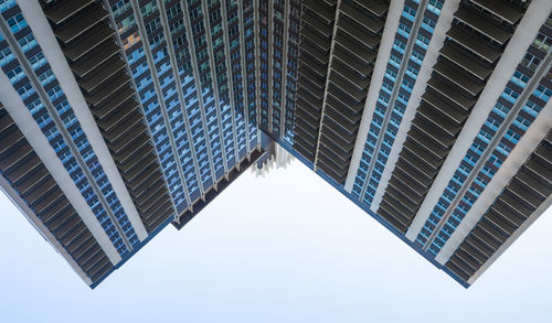 Low angle view of modern buildings against sky