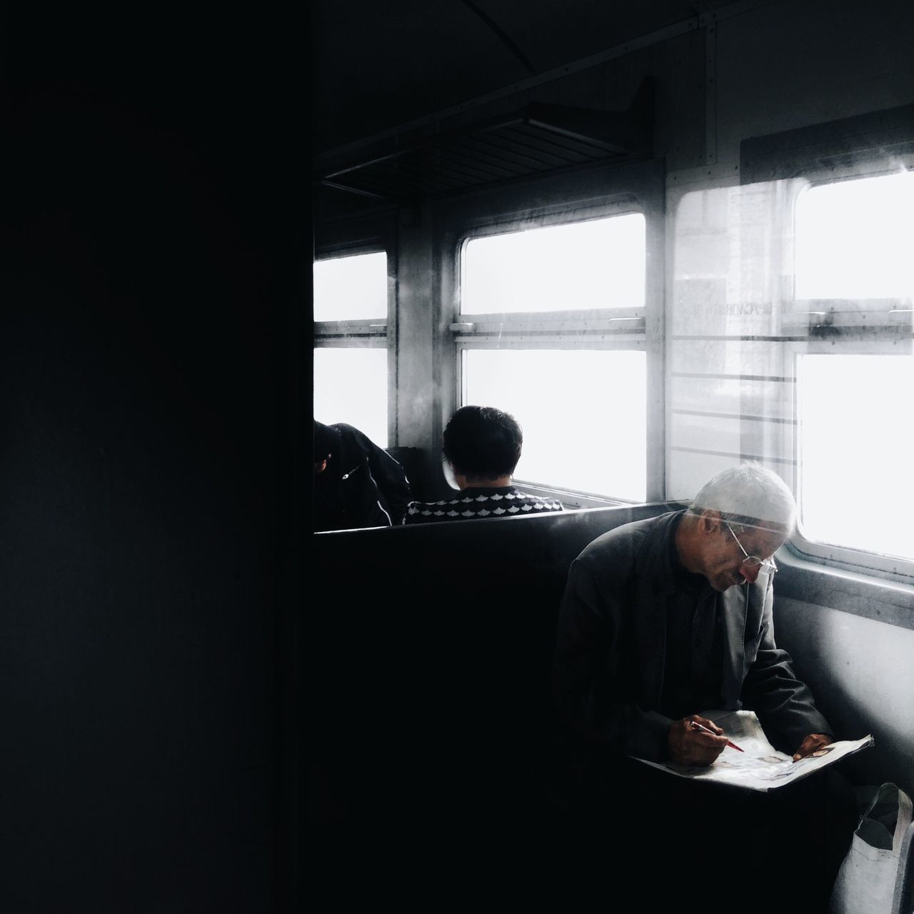 MAN AND WOMAN STANDING ON WINDOW