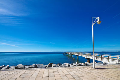 View of calm sea against blue sky
