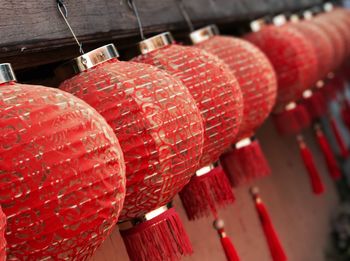 Close-up of red decorations hanging