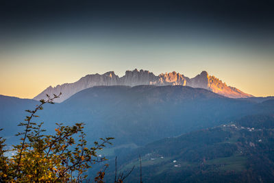 Scenic view of mountain range against sky during sunset