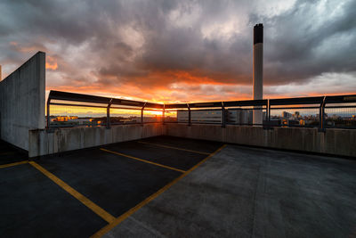 Building terrace against cloudy sky during sunset