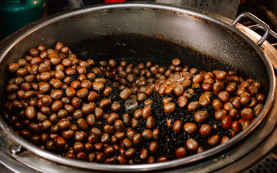 High angle view of roasted coffee beans in container