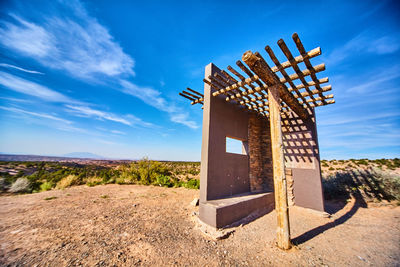 Built structure on field against sky