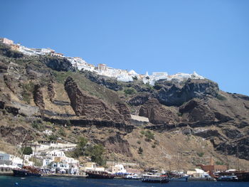 Scenic view of mountains against clear blue sky