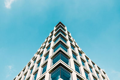 Low angle view of building against clear blue sky