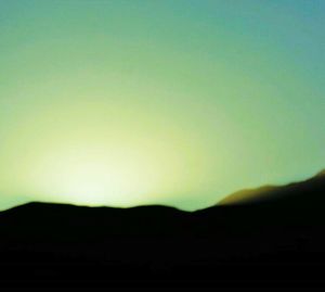 Scenic view of silhouette mountains against clear sky