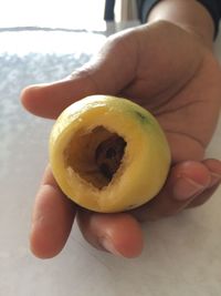 Close-up of hand holding apple