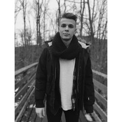 Portrait of young man standing in winter