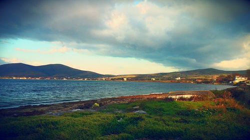 Scenic view of sea against cloudy sky