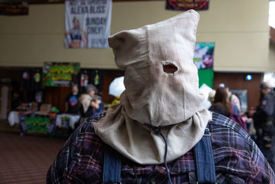 Midsection of person wearing mask